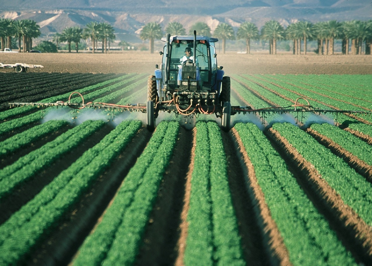 88 days of farm work - Green tractor ploughing a field